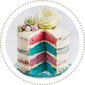 A four-layer rainbow cake with white frosting, Easter eggs and flowers A four-layer rainbow cake with white frosting, Easter eggs and flowers 11506903